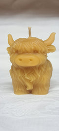 Front view of standing Highland Coo Candle