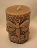 Beeswax candle with honeycomb and bee design on a beige background